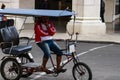 Havana, Cuba Ã¢â¬â 2019. Young Cuban waiting for tourists, guided bike tour